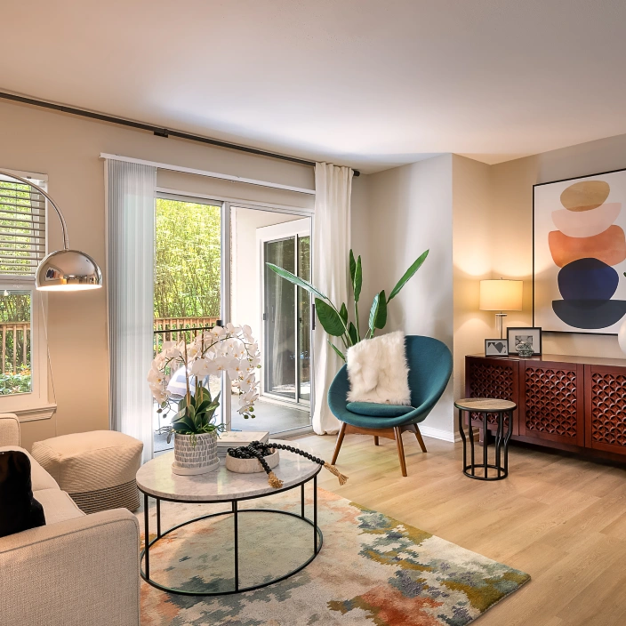 Cozy apartment living room decorated with abstract artwork, modern furniture, and warm lighting